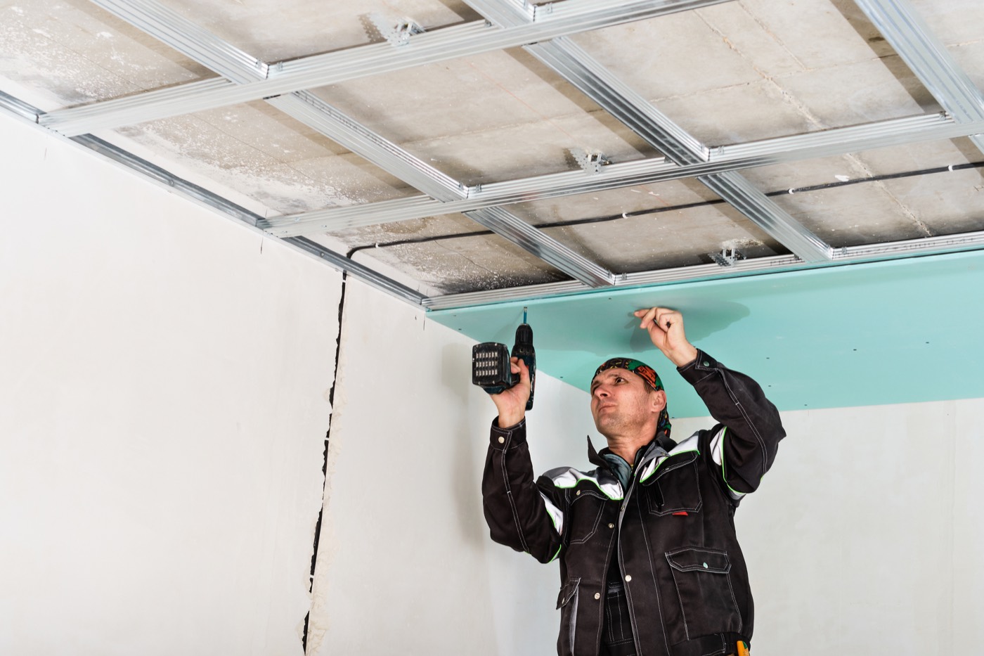 Drywall being installed inside a residential space